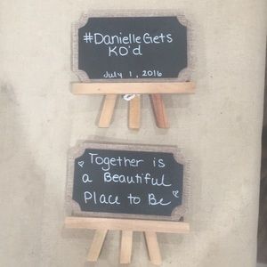 Two easel chalkboard signs